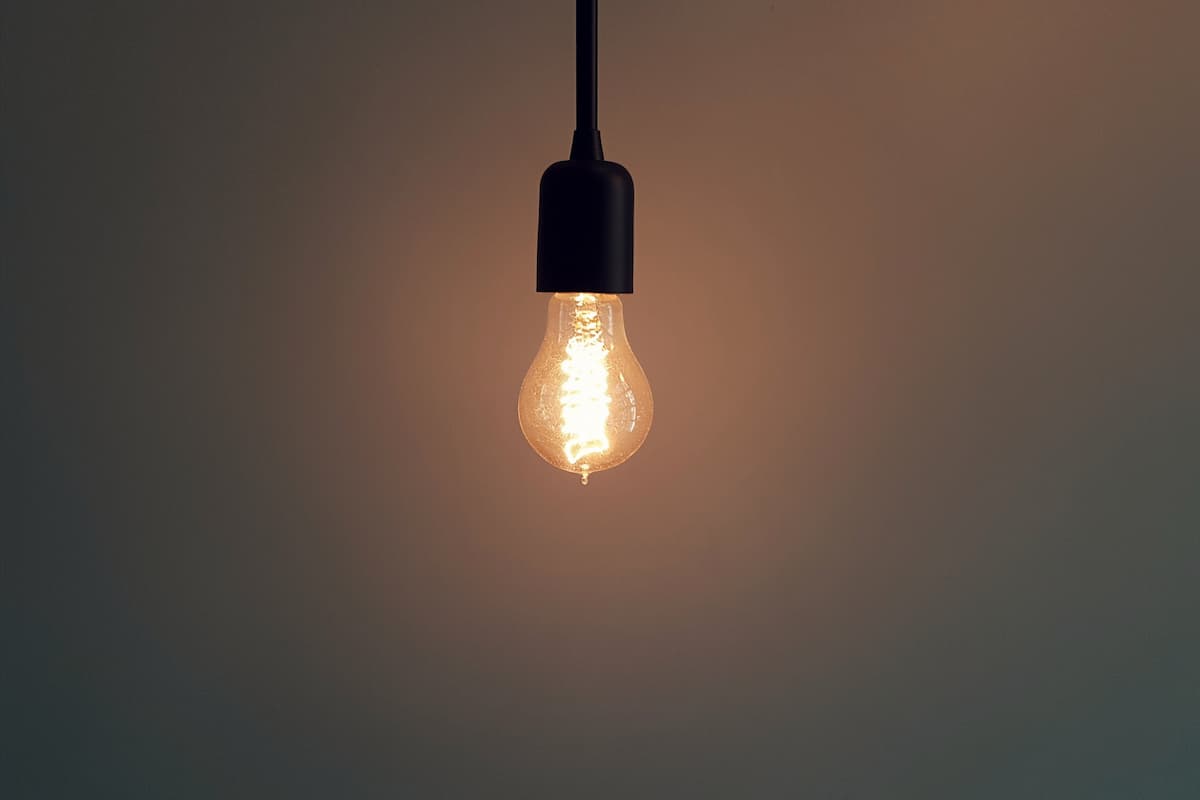 A light bulb turned on in the dark.