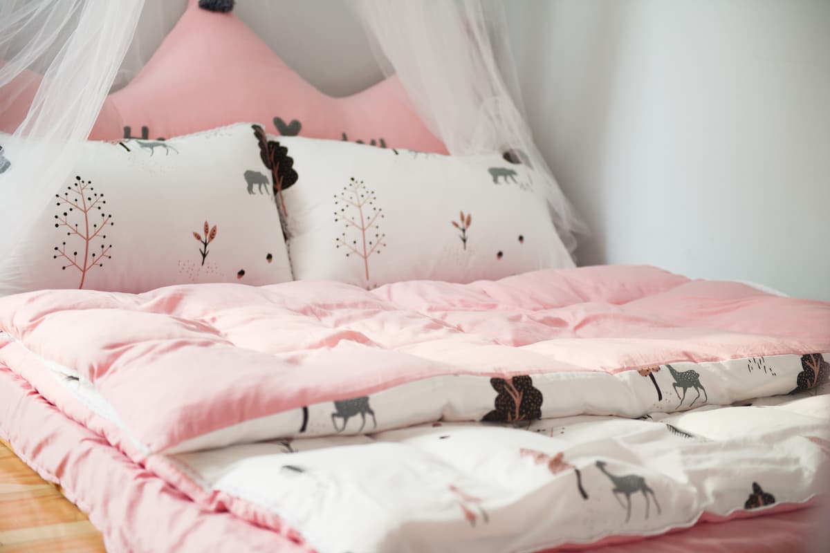 Photo of pink bed linen. 
