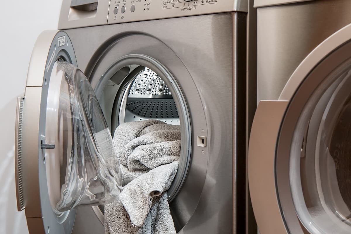 Photo of a towel in the dryer with the door open. 